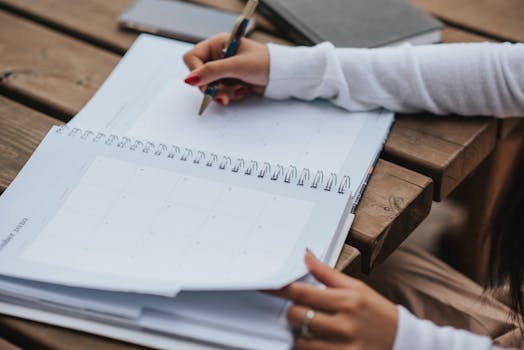 student writing in a journal