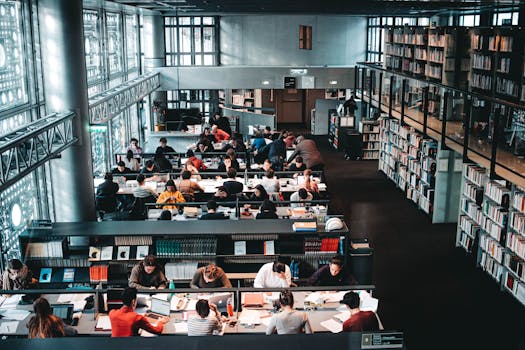 image of a busy student surrounded by textbooks