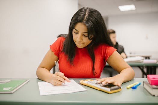 student taking notes during class