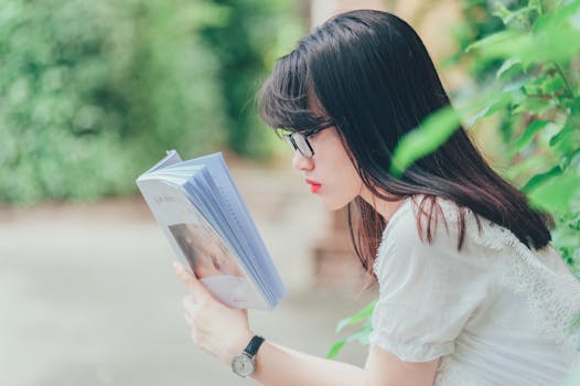 student relaxing with a book